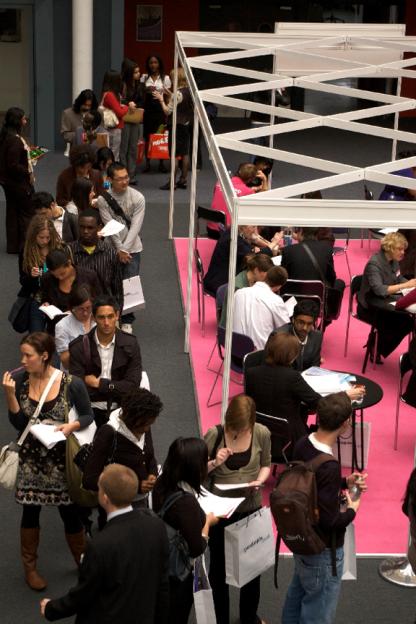 Young job seekers wait to sit down with career counselors as a job fair