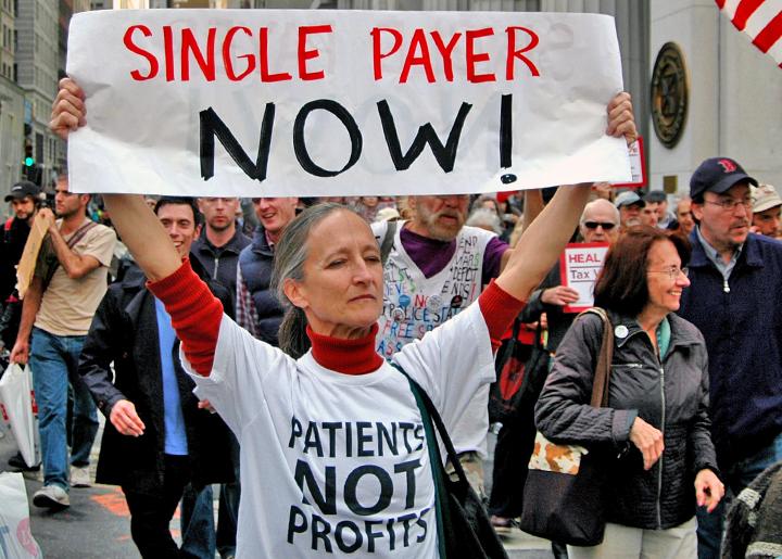 Nurses and activists march for a single-payer health care system