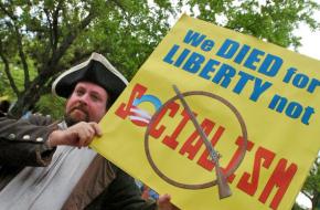 A Tea Partier and Founding Father impersonator at a rally